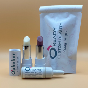 Natural vegan lip oil and lip balm duo with branded pouch, minimalist beige background