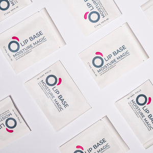 Flat lay of Lip Base Moisture Magic sample sachets, vegan natural lip care.