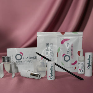 Custom beauty kit with lip bases, color mix, and makeup containers on pink satin background