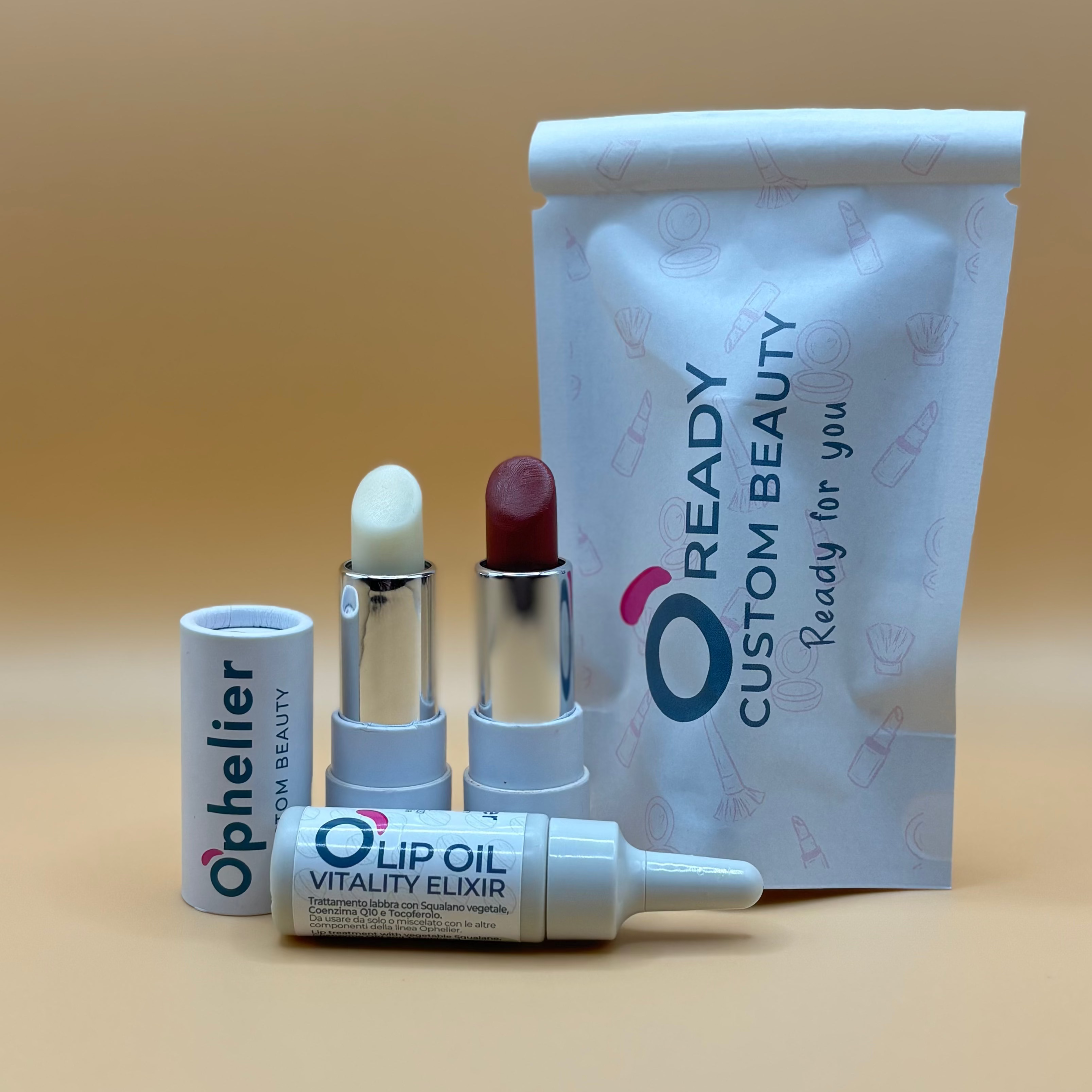 Natural vegan lipsticks and lip oil with custom beauty pouch on neutral background