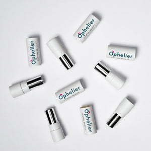 Assorted white lipstick tubes with chrome accents arranged on a white background.