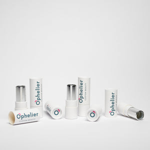 Assorted white makeup lipstick tubes arranged on a clean white background