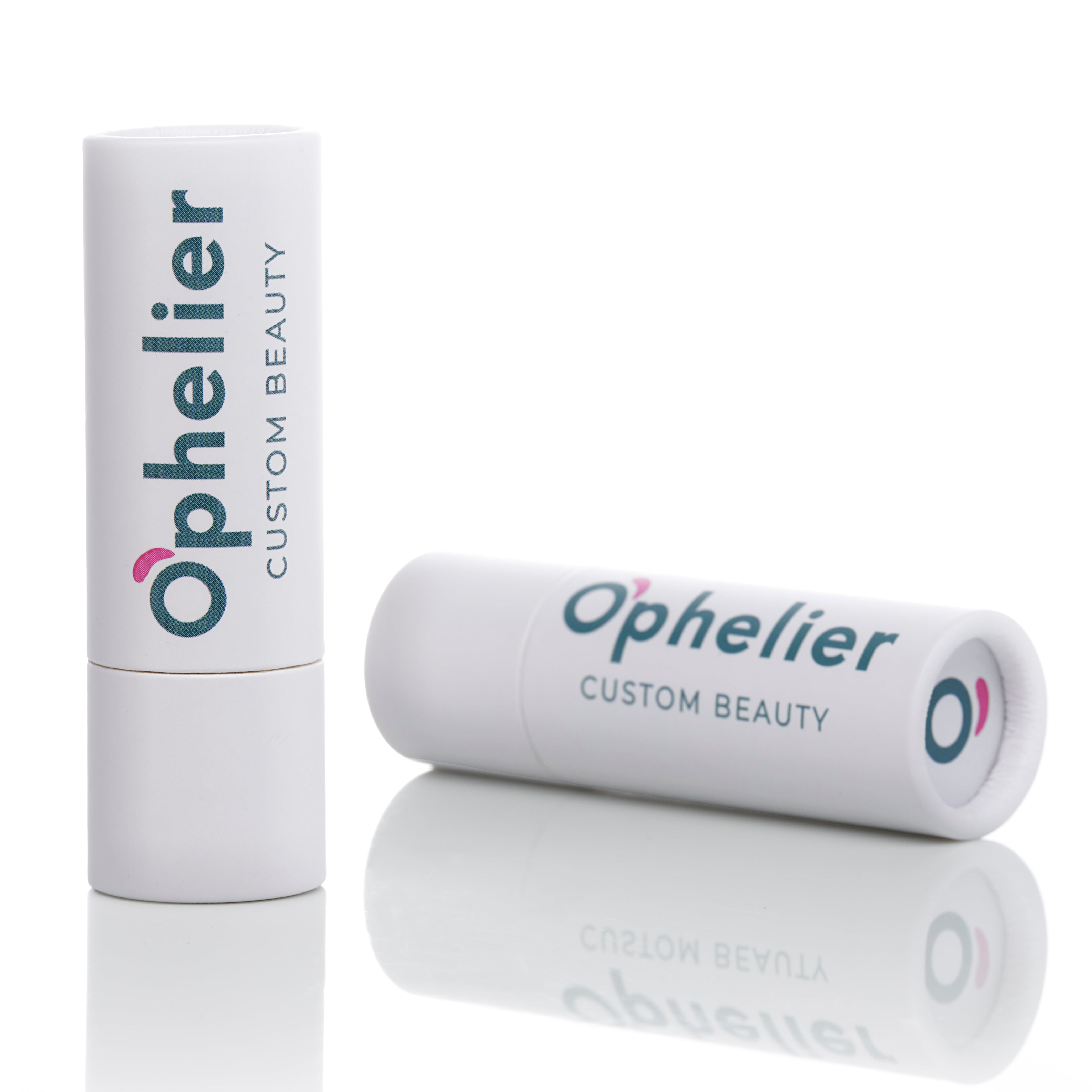 White tube lip balm with custom beauty label on reflective surface
