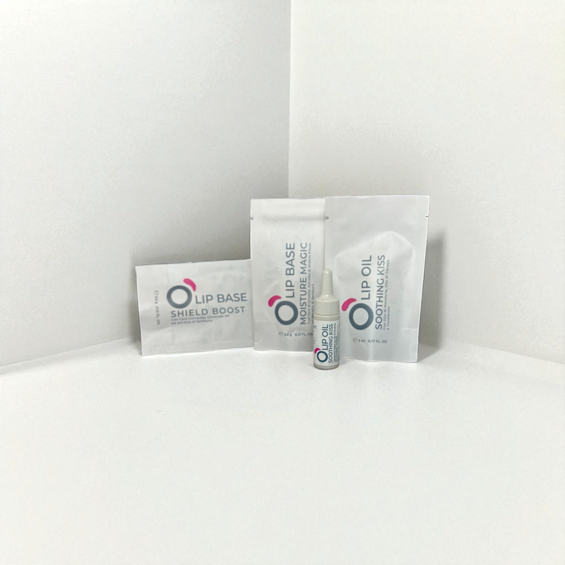 Vegan lip care kit with lip base, lip oil, and moisture mask in minimalist white packaging