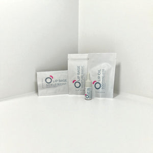 Vegan lip care kit with lip base, lip oil, and moisture mask in minimalist white packaging