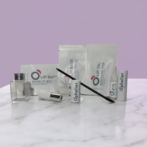 Custom lip care and beauty products on a marble surface with a light purple background.