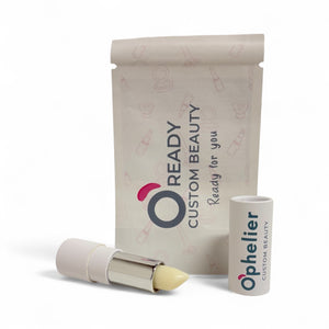 Vegan natural lipstick with white case, custom beauty packaging in background
